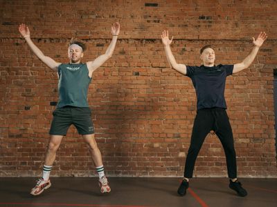 Shadow of a person doing jumping jacks